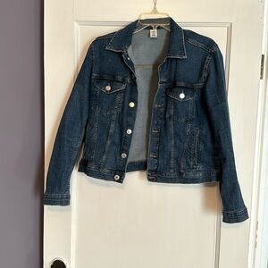 Denim jacket hits above waist.
